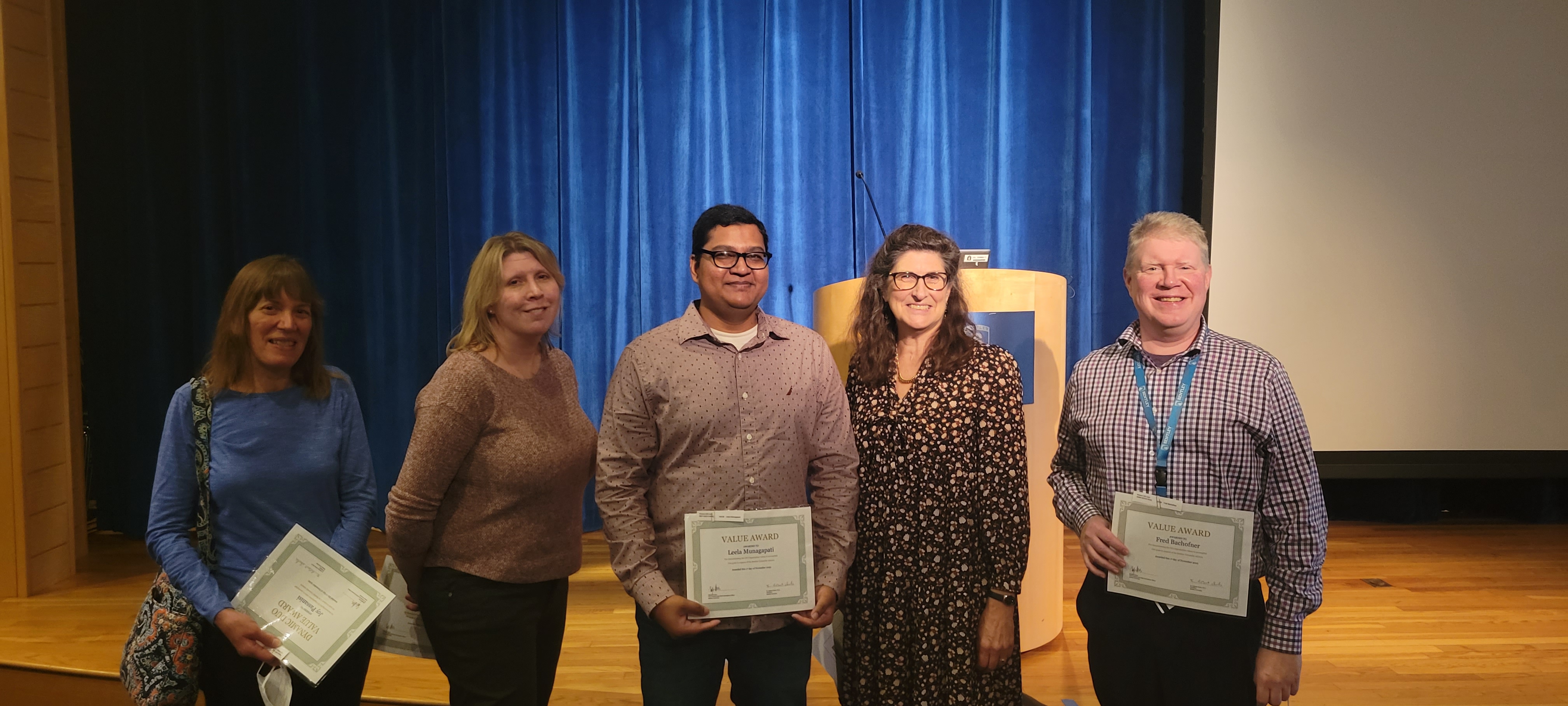 leadership team accepting awards 