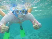 Bentley female student scuba diving in the Great Barrier Reef in Australia