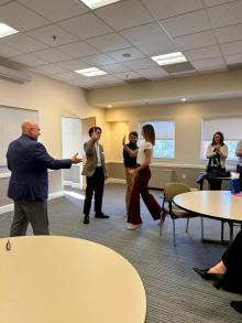 A man about to shake a woman's hand