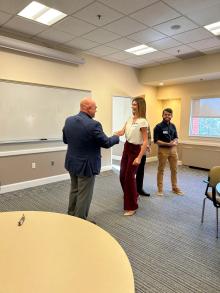 Man shaking woman's hand