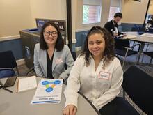Two smiling students.