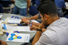 A student thinks while using a worksheet.