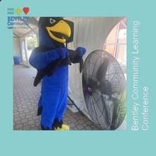 Falcon mascot cooling off near large fan