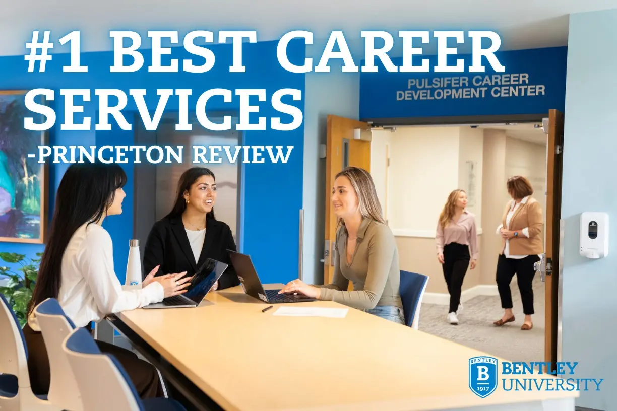 This is an image of female students sitting around a conference table.