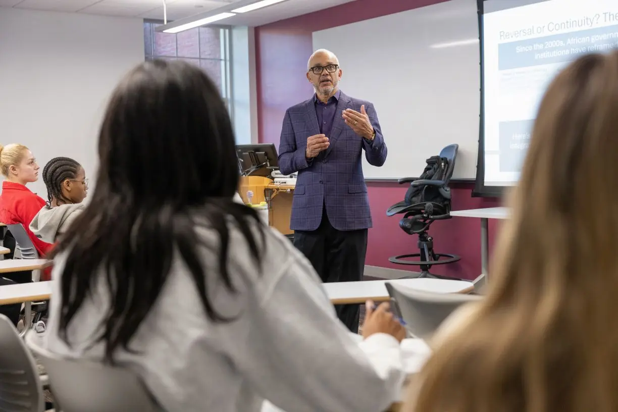 Bentley President E. LaBrent Chrite teaching first-year students in a classroom during Falcon Discovery Seminar