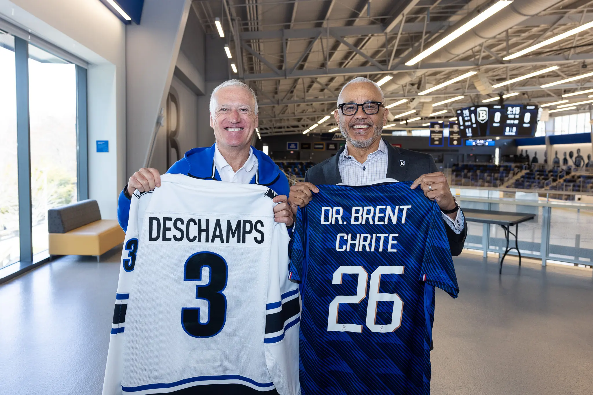 Didier Deschamps — manager of French national football team, l’équipe de France de football — and Bentley President E. LaBrent Chrite hold team jerseys
