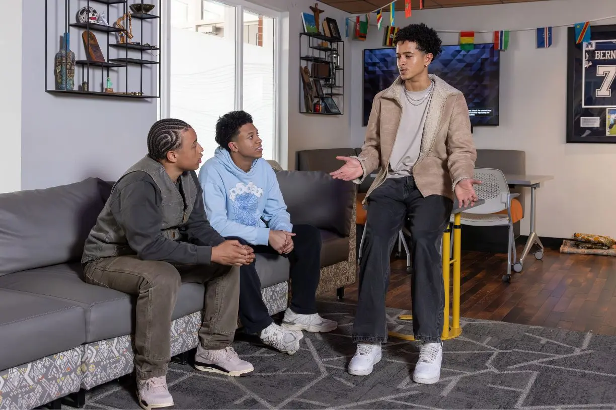 Kevin Aprea Cabrera '26 talks with Markus Facey-Castillo '27 and Emilio Jose Silva-Rosa '29