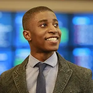 bentley student brandon samba works in the trading room