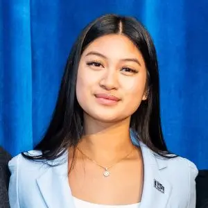 Rosa Chhay wearing light blue suit