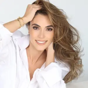 Headshot of Kristina Ayanian ’19, wearing a white button-up blouse.