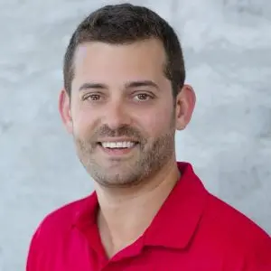 Headshot of Tom D'Eri, wearing a red polo shirt 