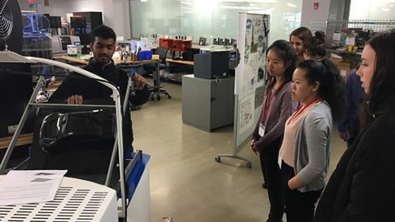 CWB Leaders watch an engineer at Dassault Systemes demonstrate their technology