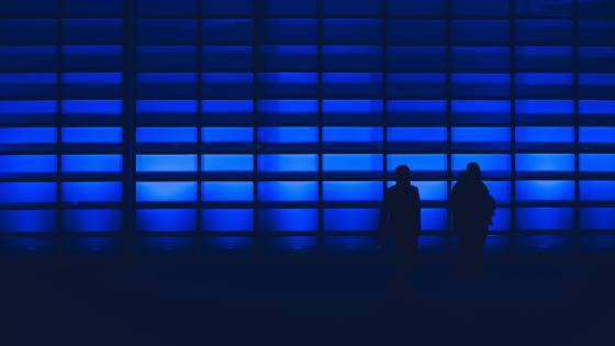 blue wall with two people