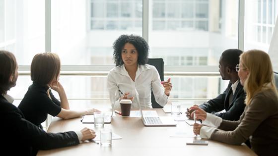 Woman leading a meeting in corporate setting