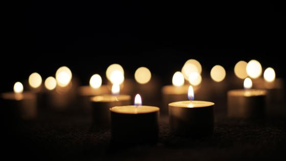 Flickering candles against dark background
