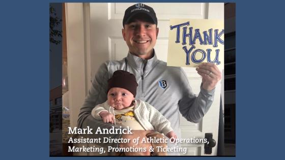 Mark Andrick with his child