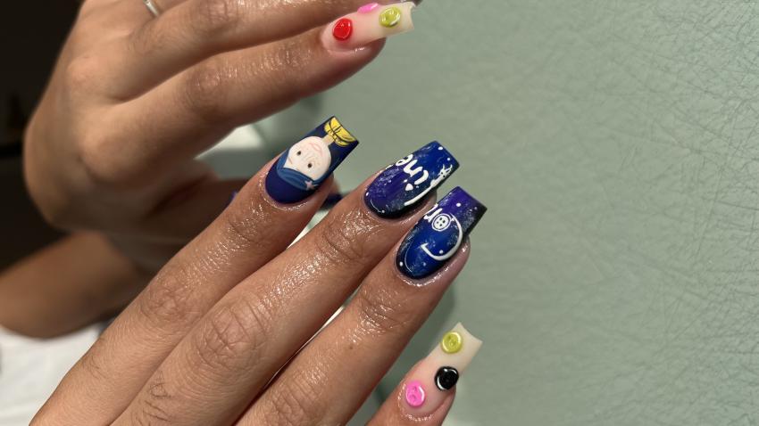 Acrylic nails with Coraline design