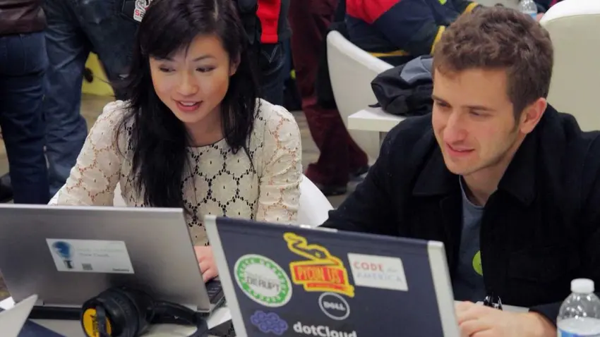 Decorative image of students working on laptops