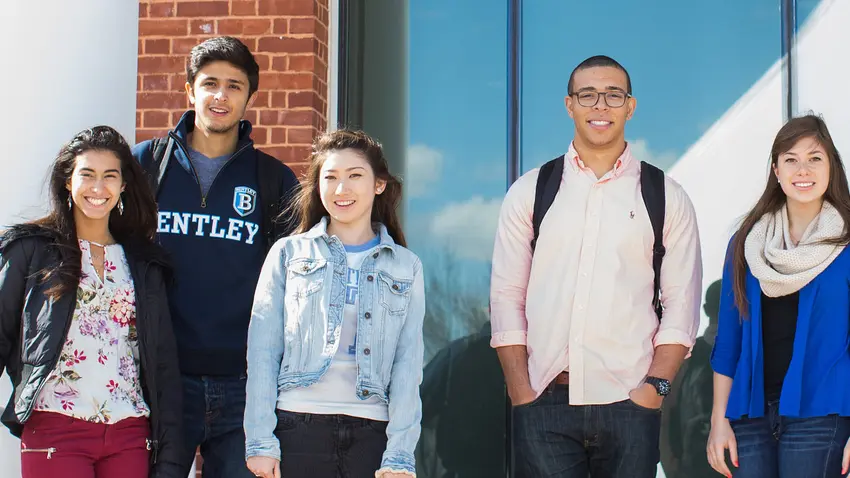 A group of international students smiling together
