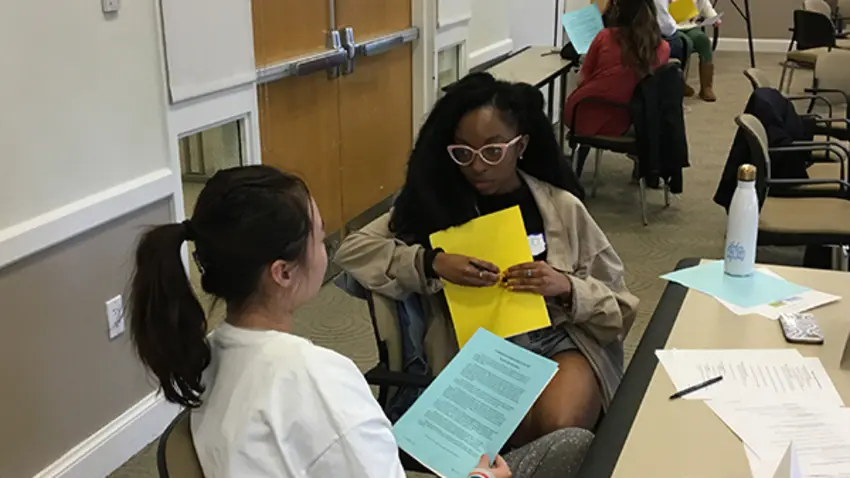 Two CWB Leaders engage in a negotiation 