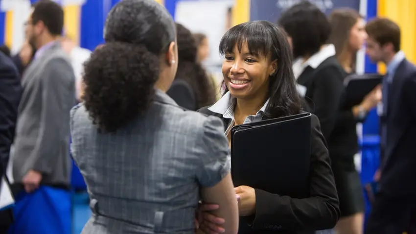 student talks to admission staff