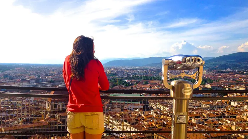 student studies abroad in italy overlooking the city