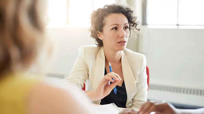 A young female executive asking a question