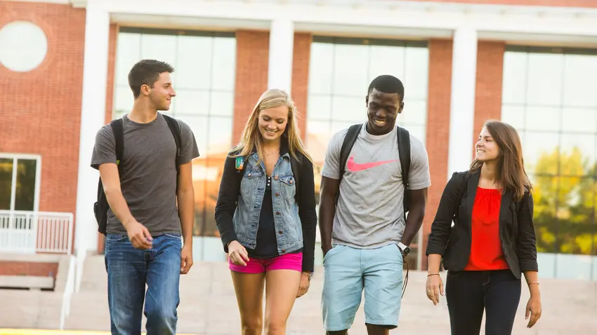 Group of students walking together on campus