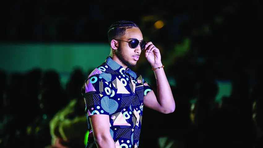 Male model with sunglasses from fashion show