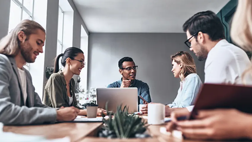 Small corporate team at conference room table 