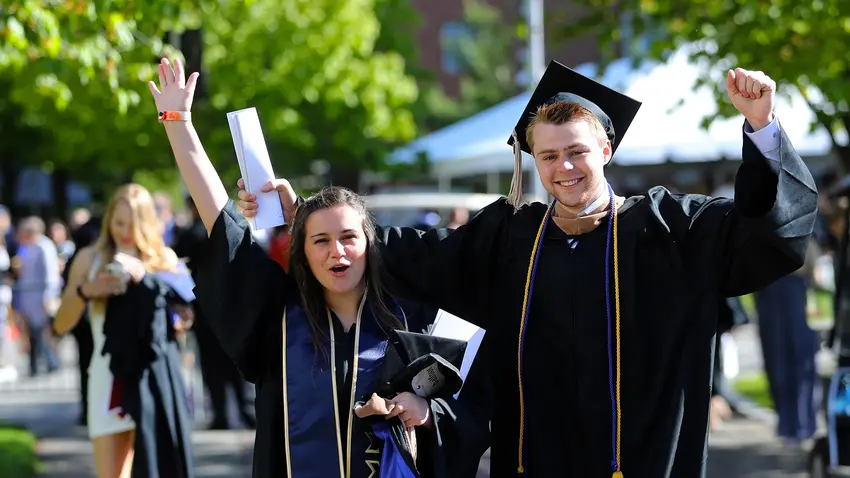 Bentley University students celebrate at graduation