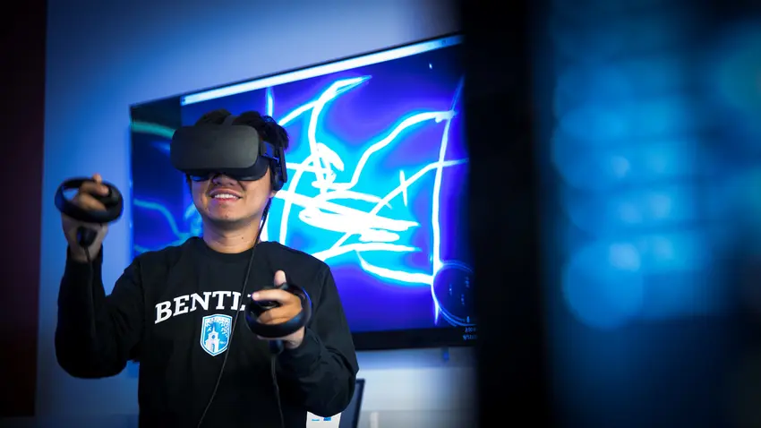 Student experimenting with virtual reality in CIS Sandbox.