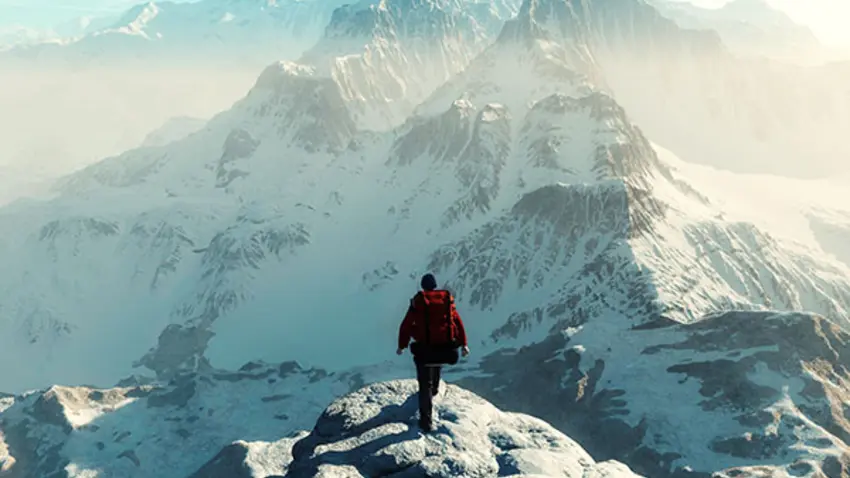 Man climbing a mountain