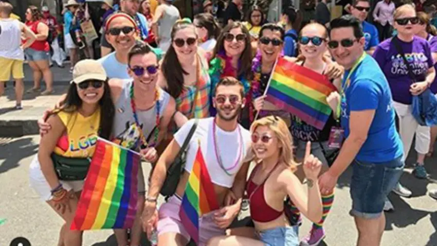 Bentley PRIDE pose for a photo a Pride Parade