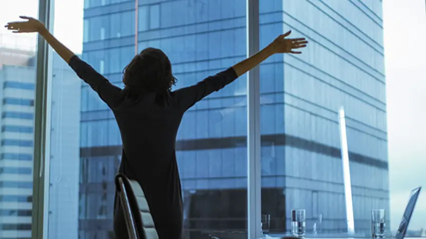 Woman celebrating success in business 