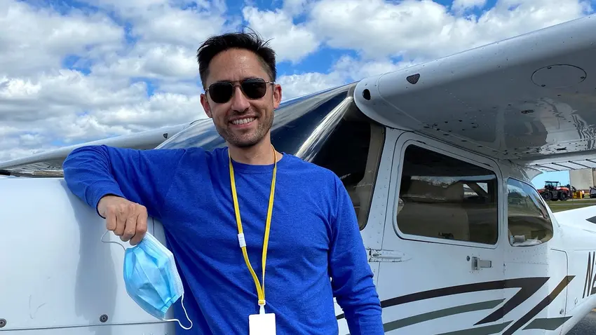 Geoff Bartlett in front of a plance