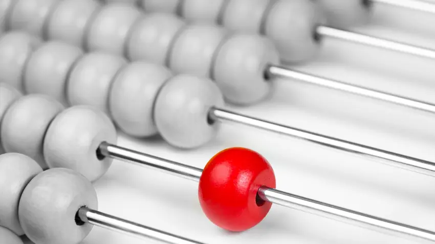 All white abacus with a single red bead
