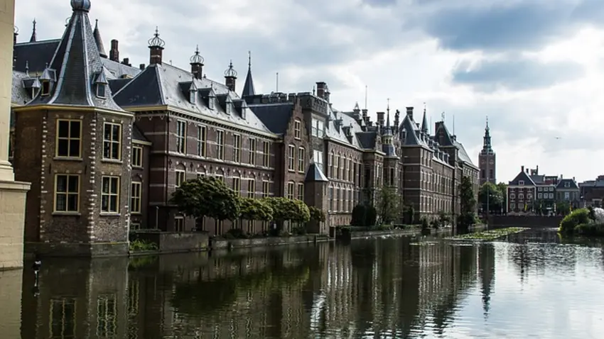 A large building next to a body of water.