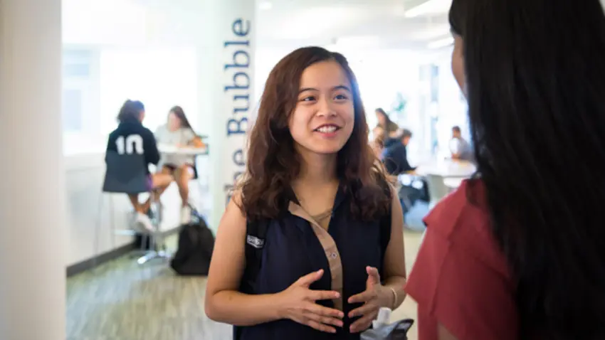 student talking in student center