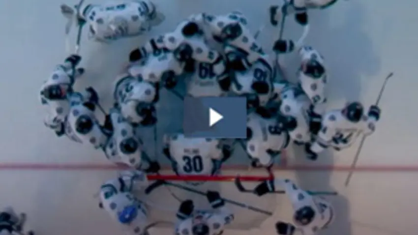 hockey game video screenshot with play button