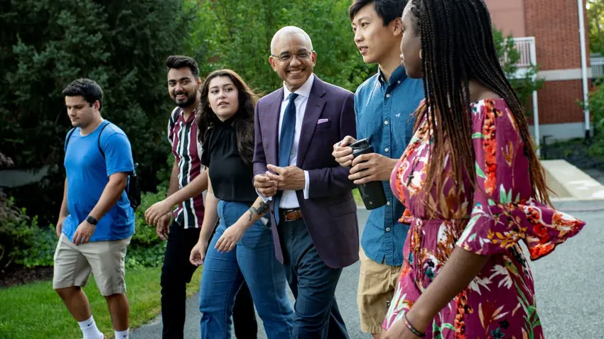 President Chrite Walking With Students