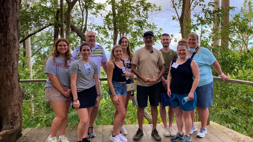 Bentley graduates students and faculty advisors pose with Mahmood Patel, owner of the Coco Hill Forest in Barbados.
