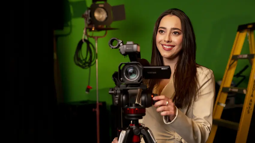 Bentley student Lindsay Toia with hand on video camera