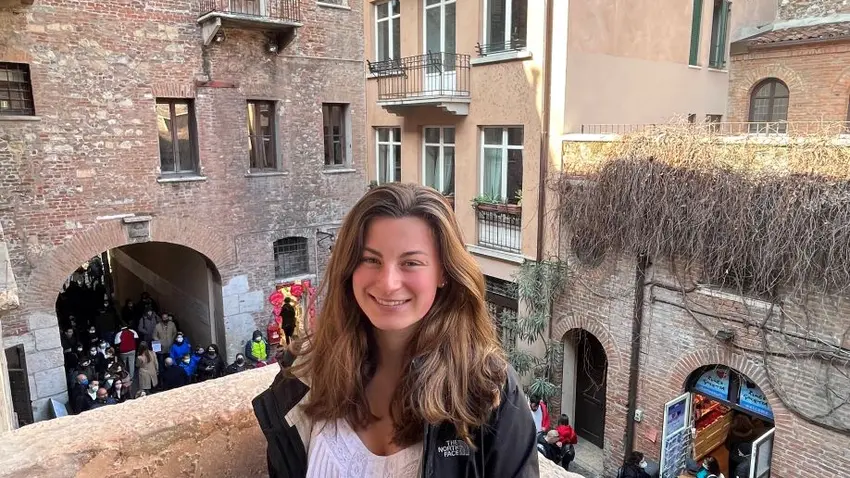 Julia MacIsaac on Juliet's balcony in Verona, Italy