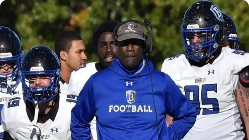 Coach Reynolds coaching on the sidelines