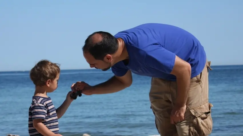 Jeff and his son on the beach