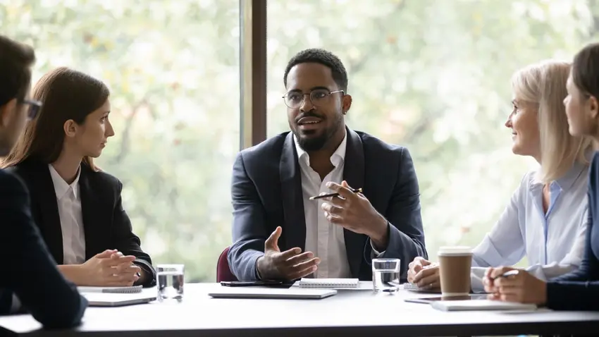 Man leading business meeting