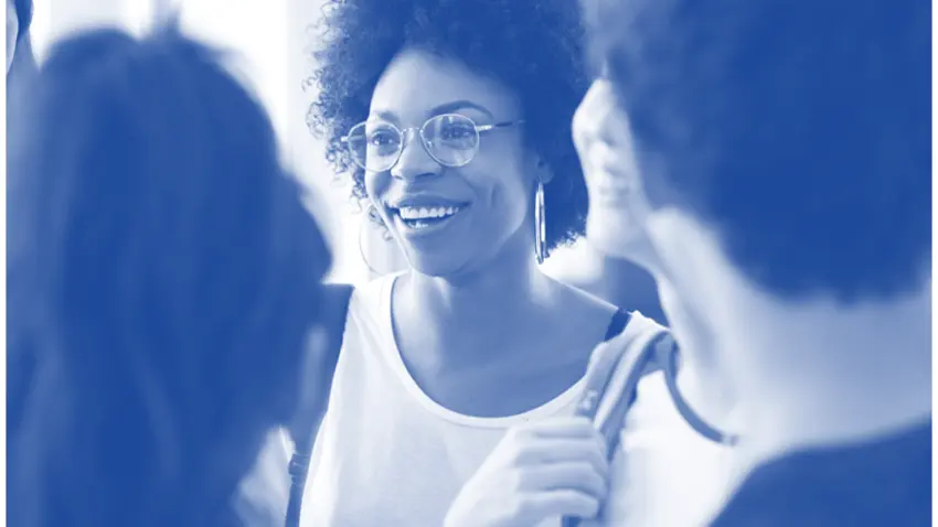 Black female talking with students