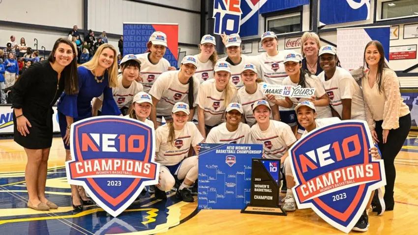 The women's basketball team with their NE10 trophy