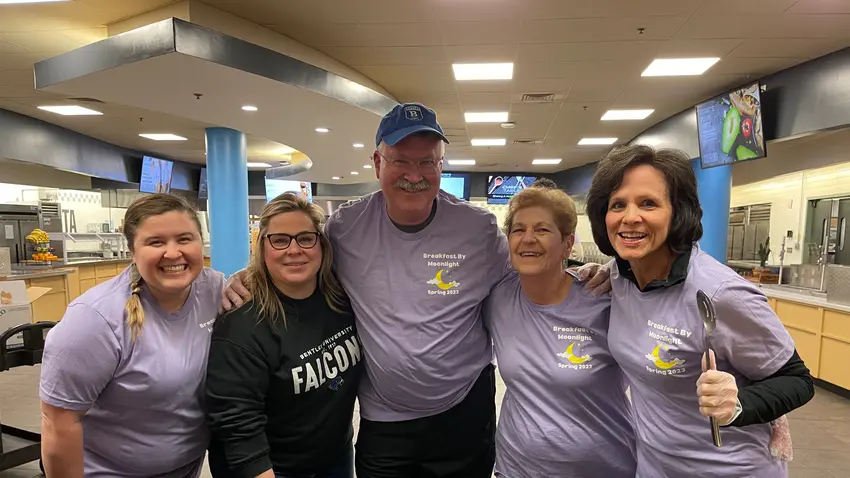 Staff serving breakfast